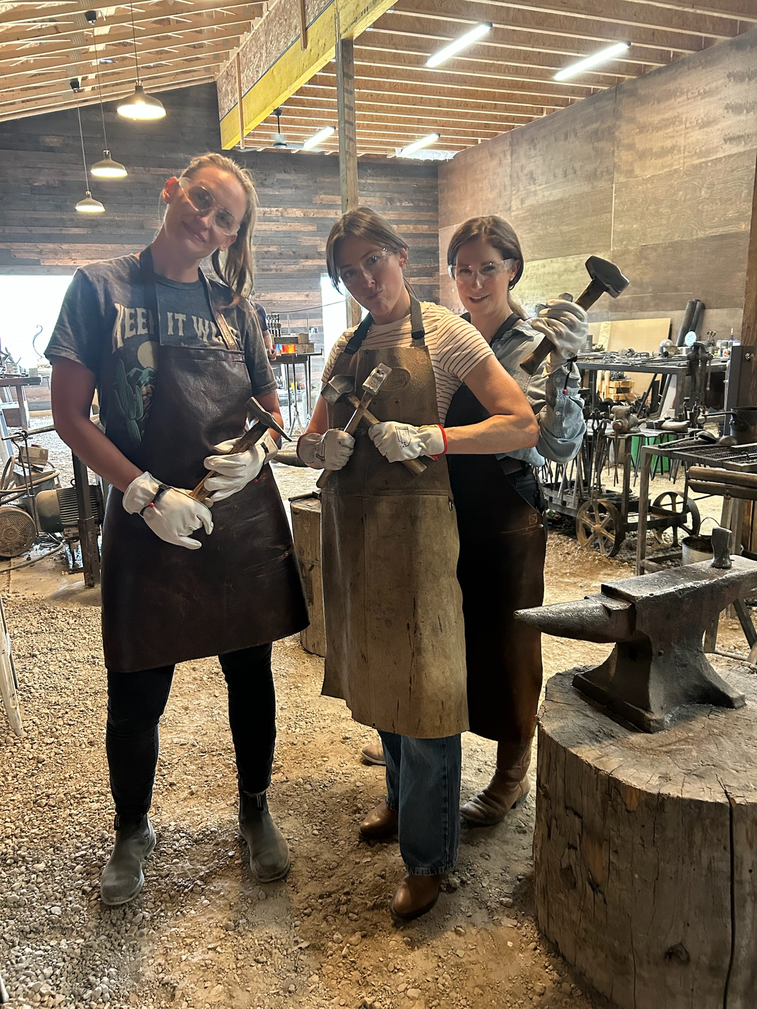 Guests working together beside the anvil