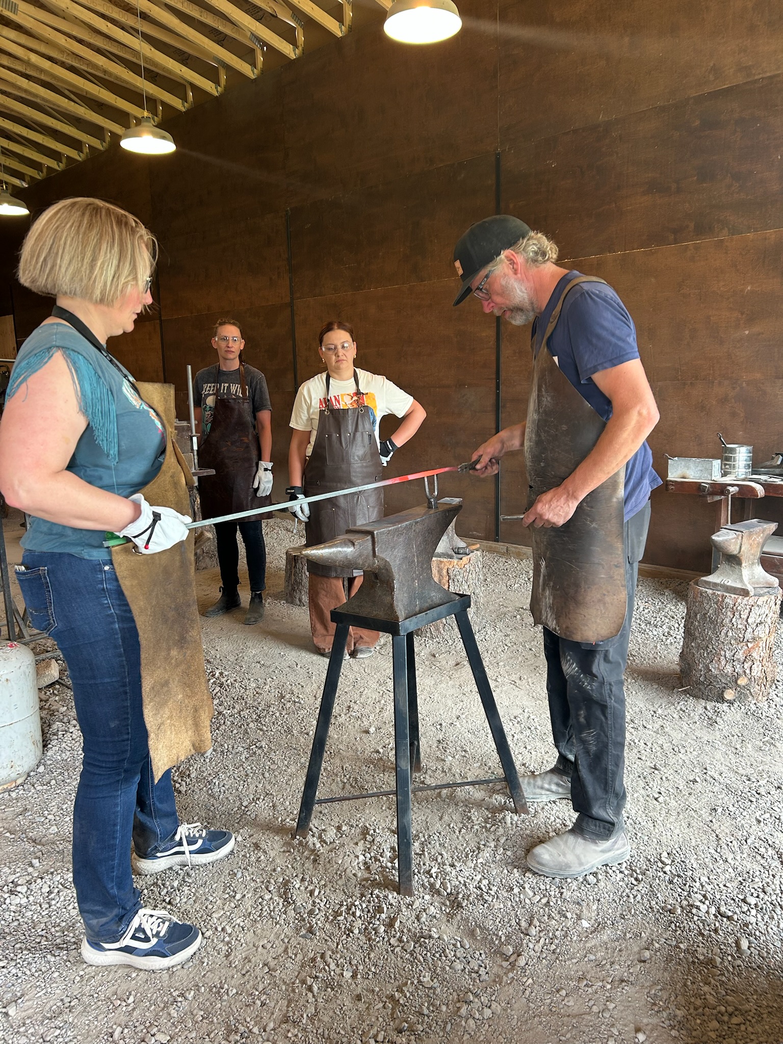 The blacksmith heating steel during the workshop