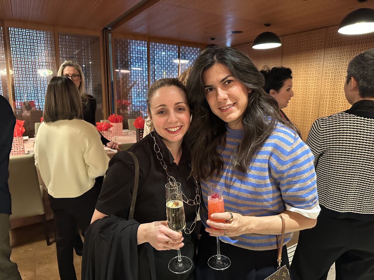 Two guests enjoying drinks at the High Tea