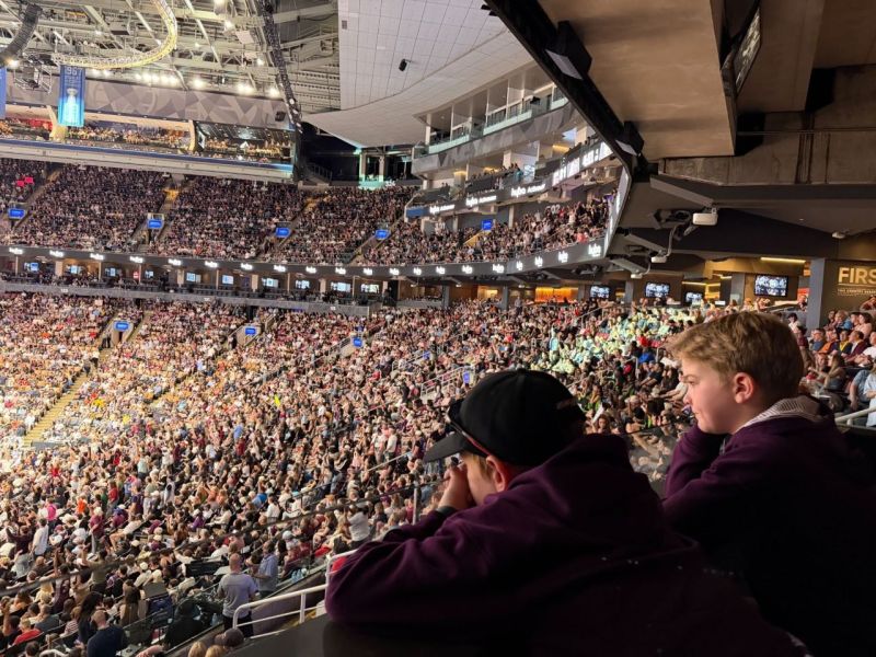 Two young guests watching the sold-out Toronto Tempo game from the suite